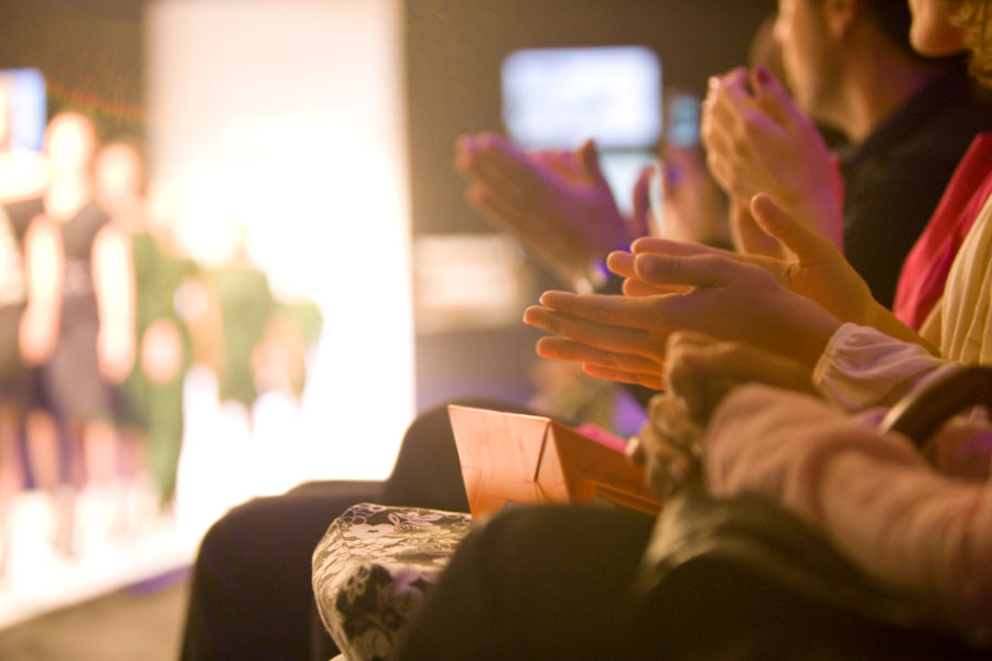 people clapping heands on a fashion event