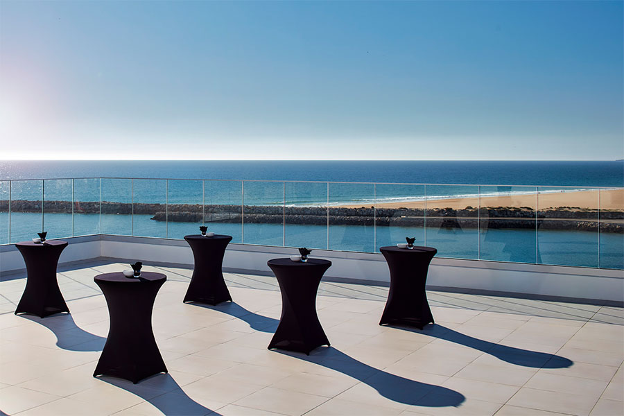 The terrace of the Algarve Congress Centre in Vilamoura with tables overlooking the ocean